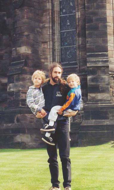 Dave Wokosin and the two boys standing in front of the chapel at Edinburgh Castle.